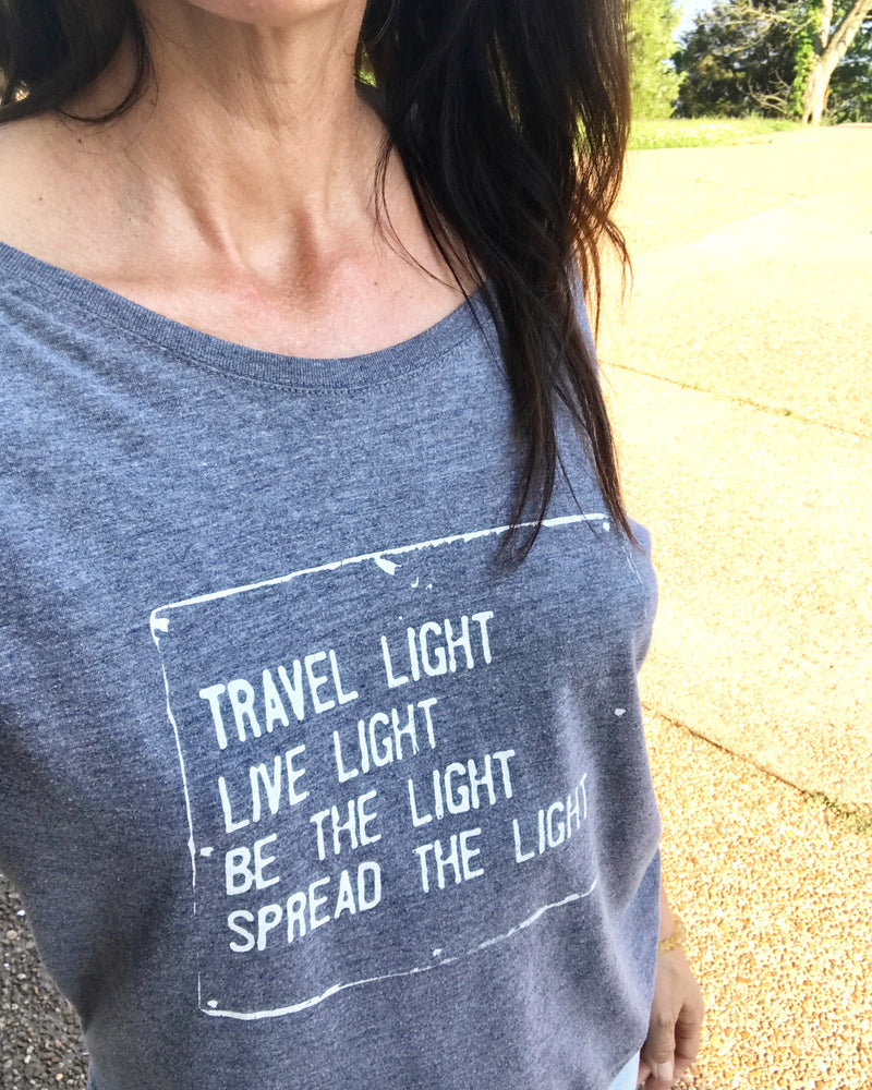 Travel Light, ...Spread The Light. Grey Wide Neck Tee